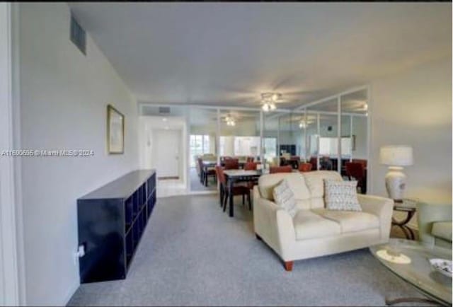 living room featuring ceiling fan