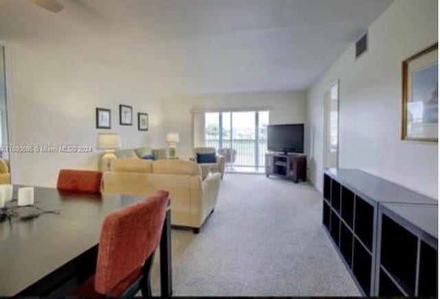 living room featuring light colored carpet