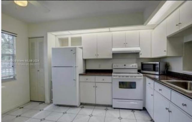 kitchen with white cabinets, ceiling fan, and white appliances