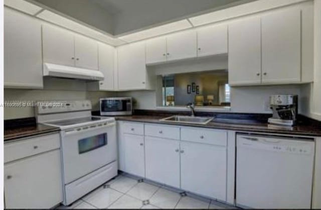 kitchen featuring white cabinets, white appliances, and sink