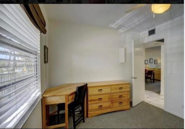 office area with light carpet and ceiling fan