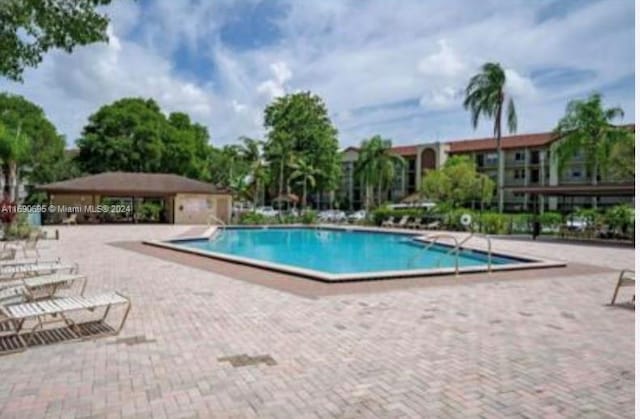 view of swimming pool featuring a patio area