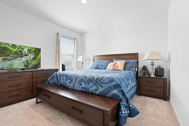 bedroom with light colored carpet