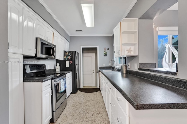 kitchen with sink, white cabinets, stainless steel appliances, and ornamental molding