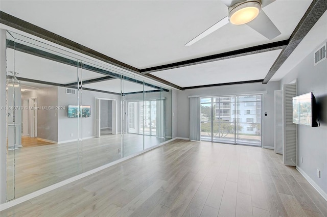 3020 NE 16th Ave Unit 306, Oakland Park, FL 33334 - spare room with beam ceiling, baseboards, ceiling fan, and light wood-type flooring