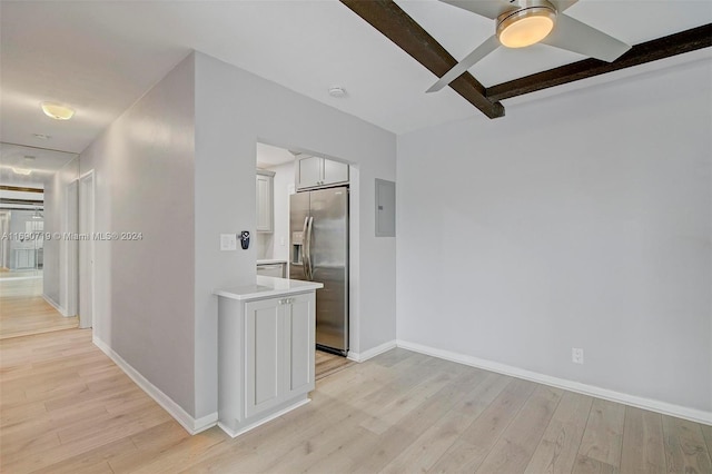 3020 NE 16th Ave Unit 306, Oakland Park, FL 33334 - spare room with electric panel, beamed ceiling, baseboards, light wood finished floors, and a ceiling fan