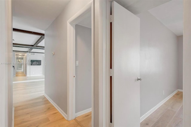 corridor with light hardwood / wood-style flooring