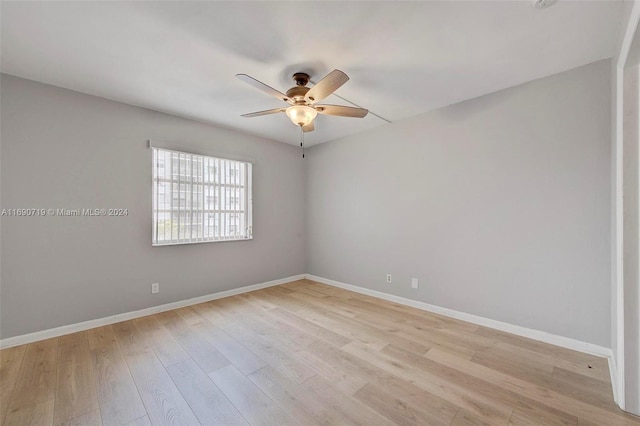 spare room with light hardwood / wood-style floors and ceiling fan