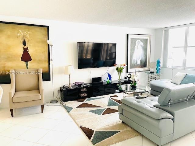 living room with a textured ceiling