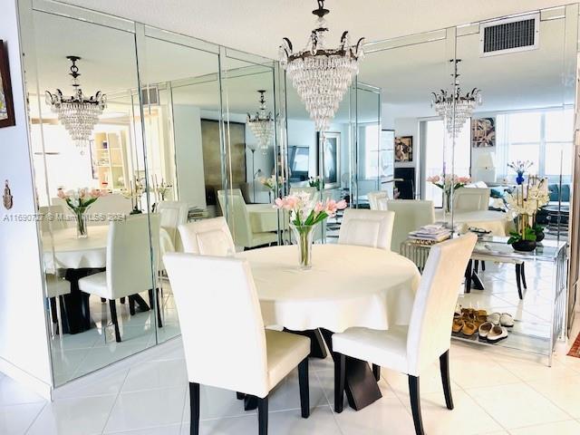 dining area featuring light tile patterned floors