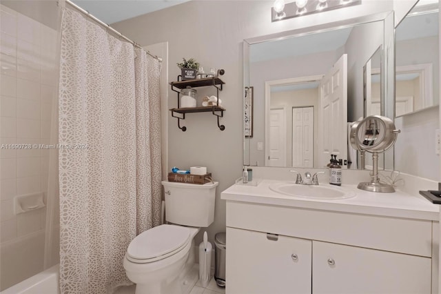 full bathroom featuring toilet, shower / bath combo, vanity, and tile patterned floors