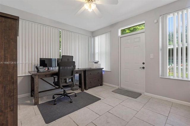 tiled office featuring ceiling fan