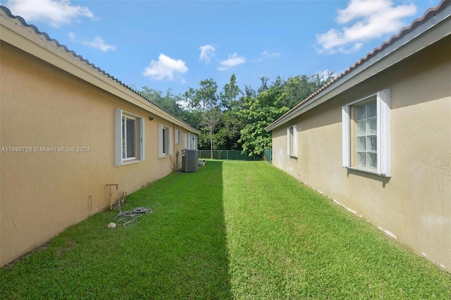 view of yard with central AC unit