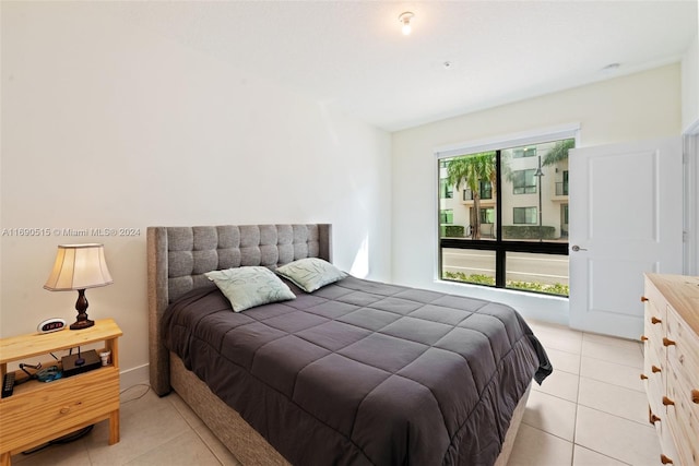 bedroom featuring light tile patterned floors