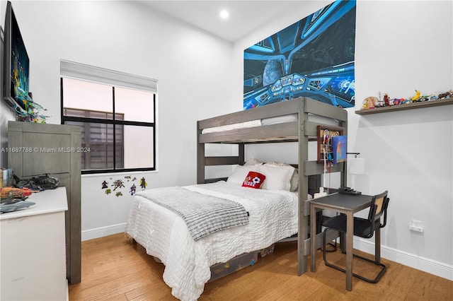 bedroom with hardwood / wood-style flooring