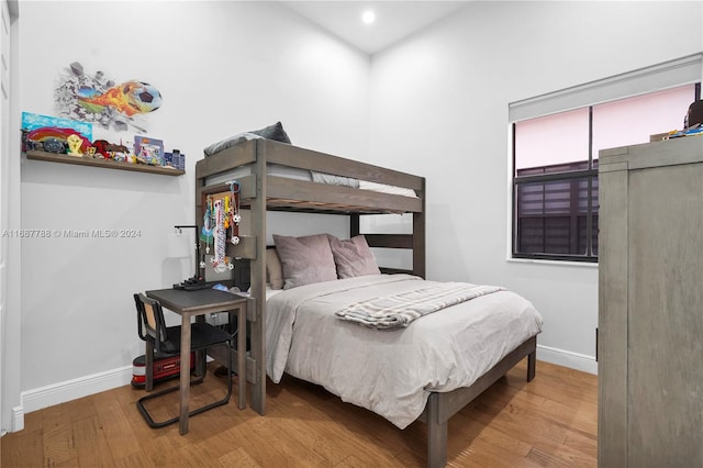 bedroom featuring hardwood / wood-style flooring