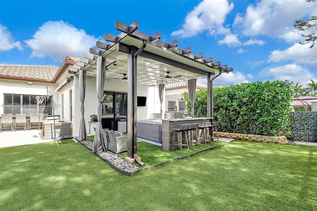 back of house with an outdoor bar, a pergola, and a yard