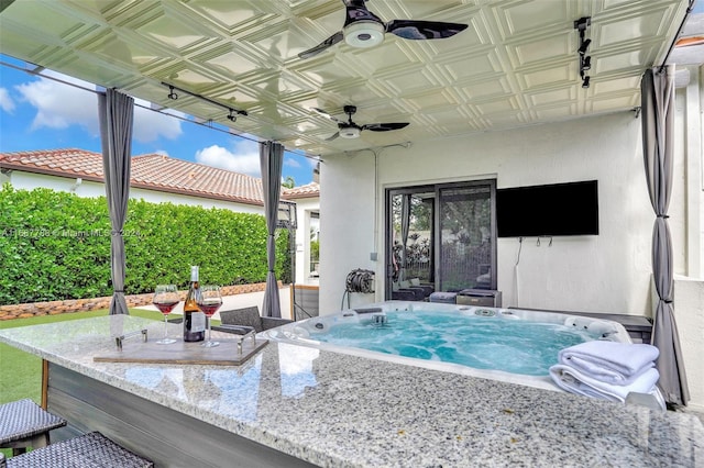 view of patio with ceiling fan