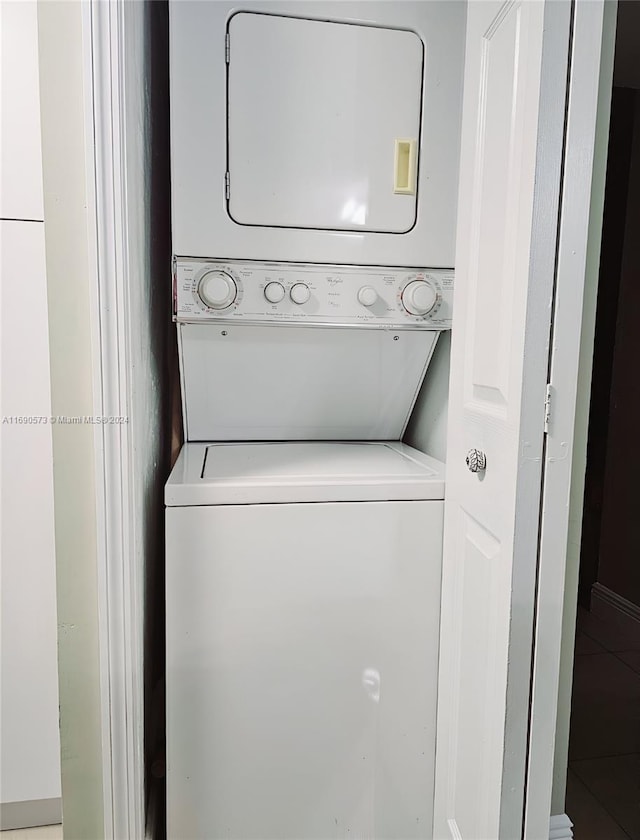 laundry room featuring stacked washing maching and dryer