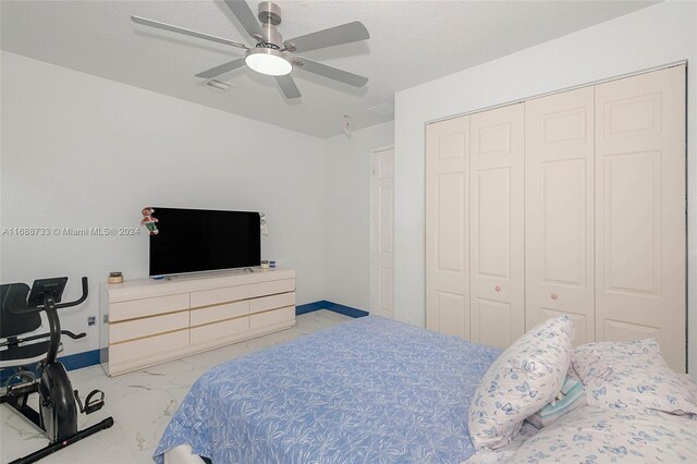 bedroom with a closet and ceiling fan