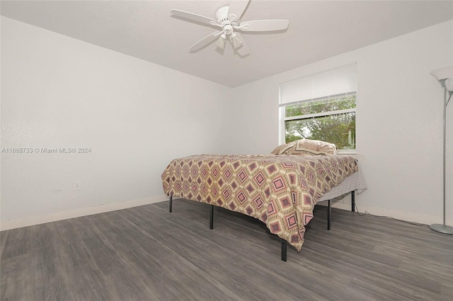 bedroom with dark wood-type flooring and ceiling fan