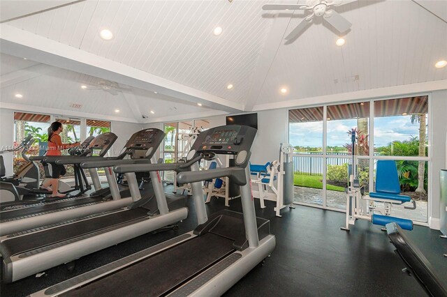 exercise room with ceiling fan and vaulted ceiling