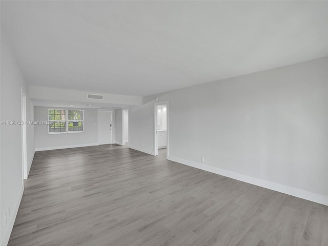 unfurnished room with light hardwood / wood-style flooring