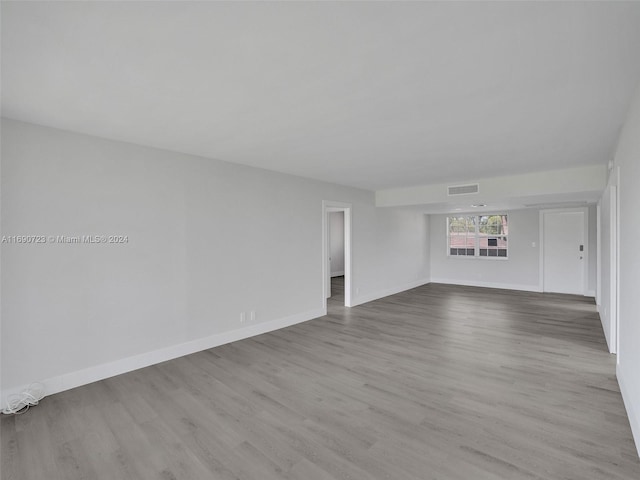 empty room with light hardwood / wood-style floors