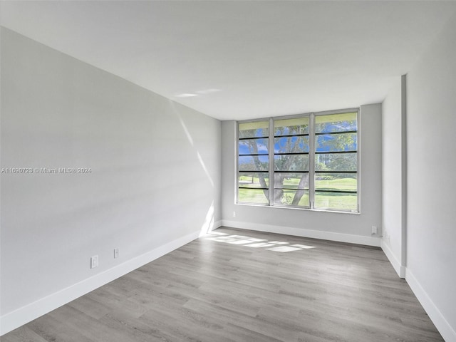 spare room featuring hardwood / wood-style flooring