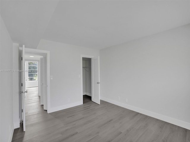 empty room featuring wood-type flooring