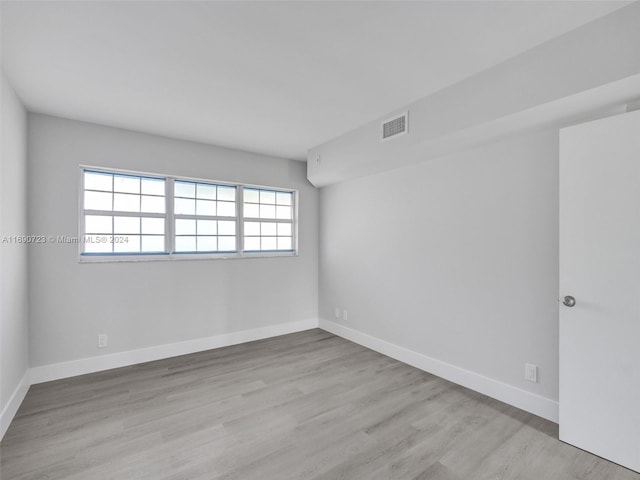 3700 Oaks Clubhouse Dr Unit 203, Pompano Beach, FL 33069 - unfurnished room featuring baseboards and wood finished floors