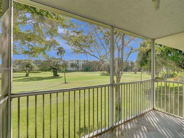 3700 Oaks Clubhouse Dr Unit 203, Pompano Beach, FL 33069 - unfurnished sunroom with view of golf course