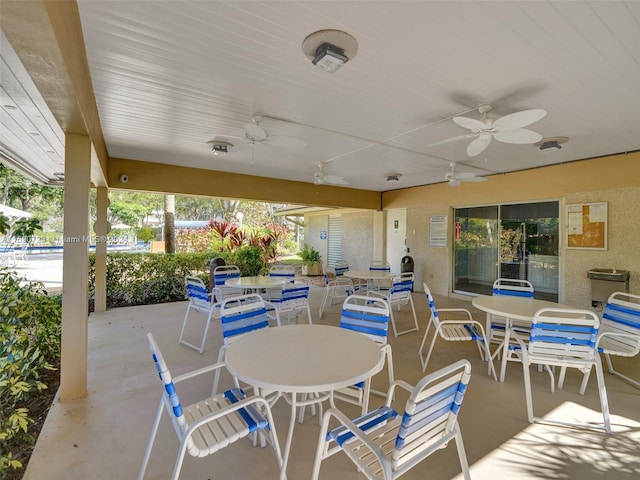 3700 Oaks Clubhouse Dr Unit 203, Pompano Beach, FL 33069 - view of patio / terrace featuring outdoor dining space and ceiling fan