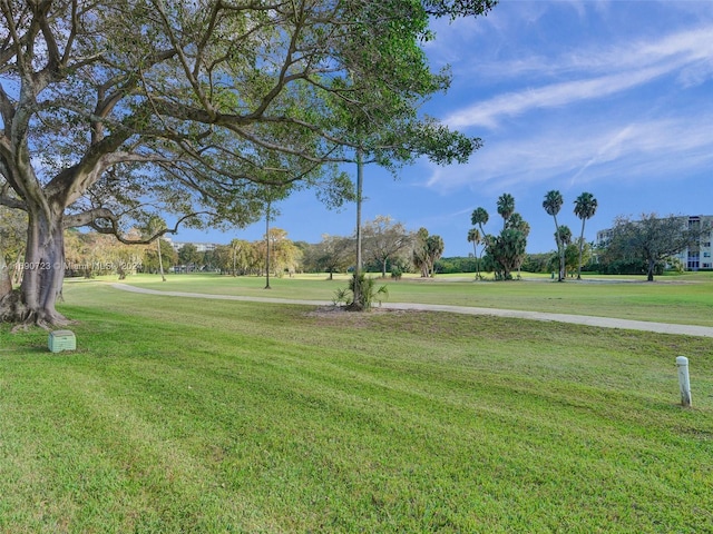 3700 Oaks Clubhouse Dr Unit 203, Pompano Beach, FL 33069 - surrounding community with a yard