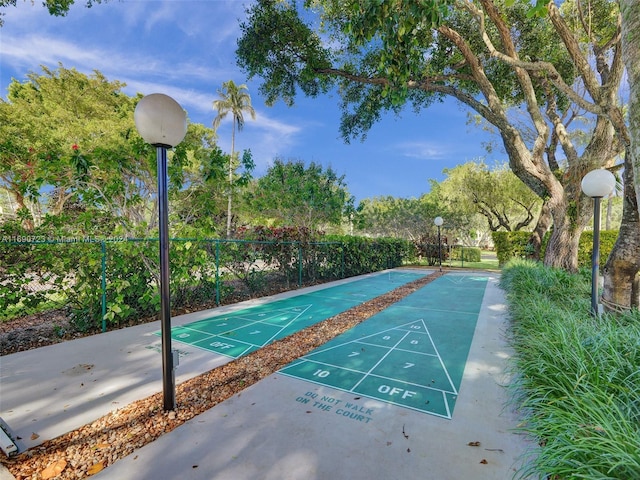 3700 Oaks Clubhouse Dr Unit 203, Pompano Beach, FL 33069 - view of property's community with fence and shuffleboard