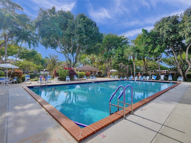 3700 Oaks Clubhouse Dr Unit 203, Pompano Beach, FL 33069 - community pool featuring a patio