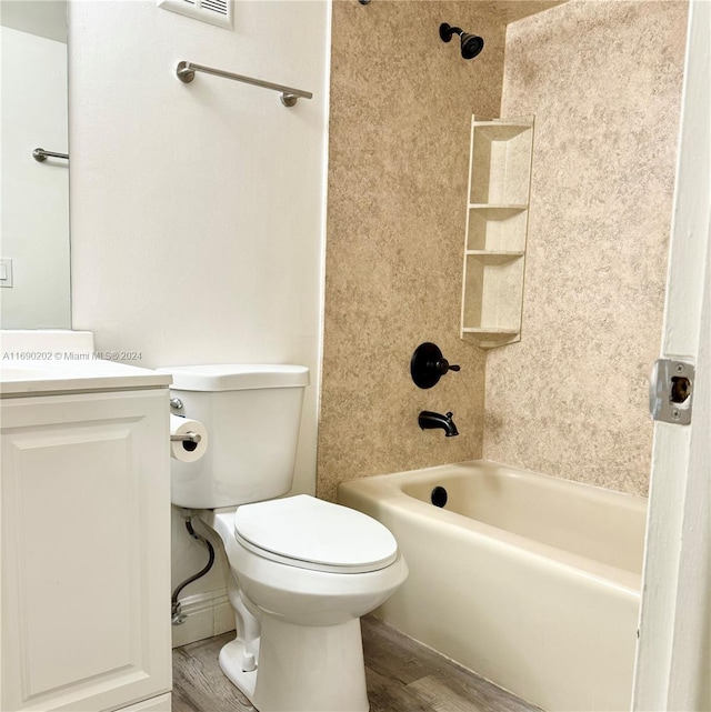 full bathroom with wood-type flooring, toilet, vanity, and tiled shower / bath