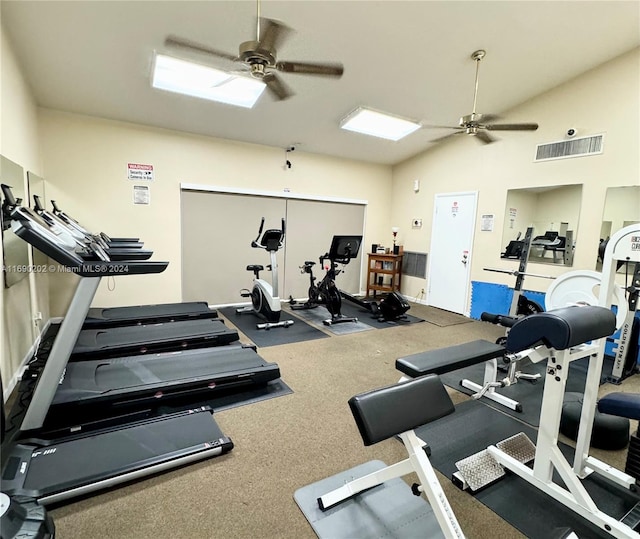 workout area featuring ceiling fan and vaulted ceiling