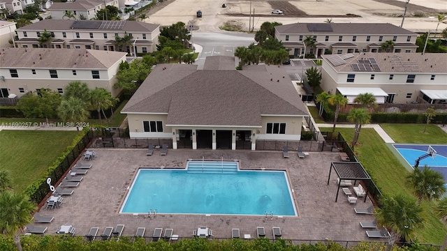 view of swimming pool featuring a yard and a patio area