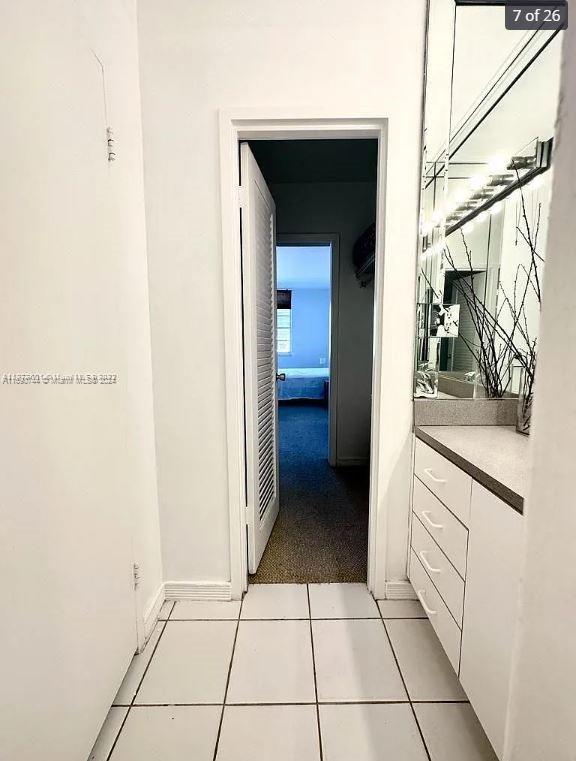 corridor featuring light tile patterned floors