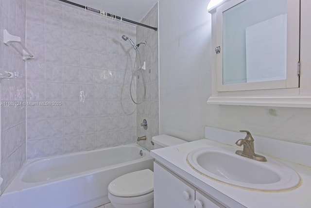 full bathroom featuring vanity, toilet, and tiled shower / bath