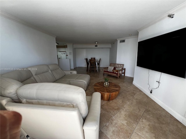 living room with tile patterned flooring and crown molding