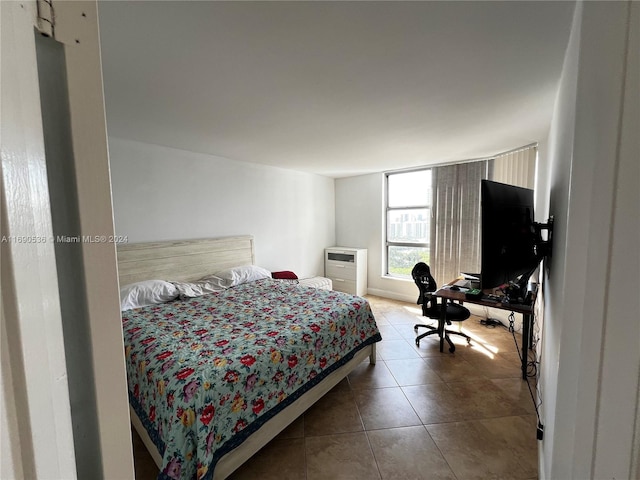 bedroom featuring tile patterned flooring