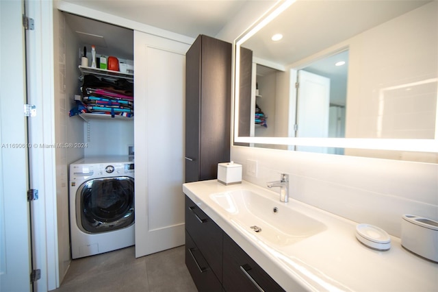 bathroom featuring washer / dryer and vanity