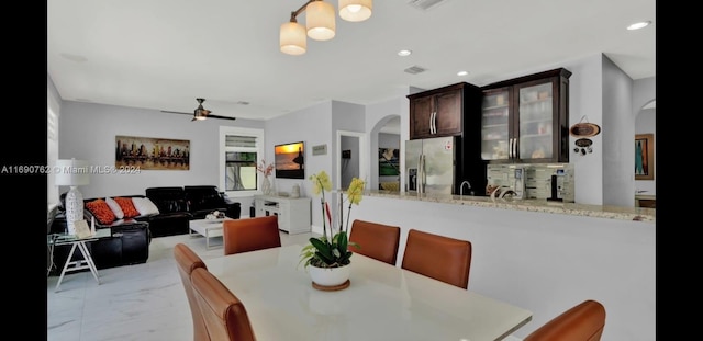 dining room with ceiling fan