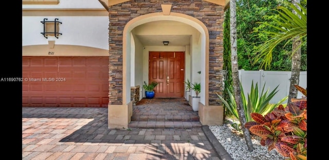 property entrance with a garage