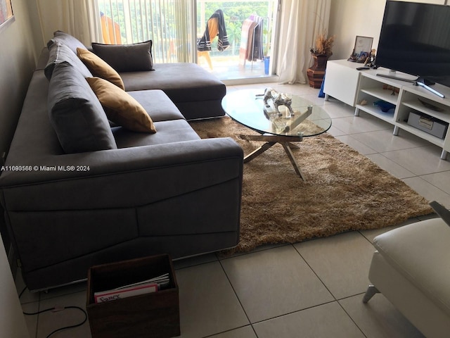 living room with tile patterned flooring