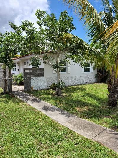 view of home's exterior with a yard