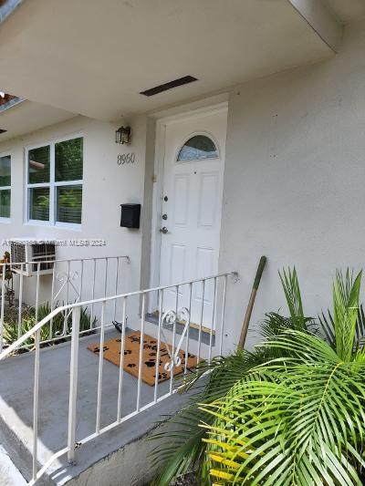 8960 NE 2nd Ave, El Portal, FL 33138 - doorway to property with stucco siding