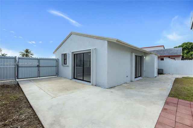 rear view of property featuring a patio area